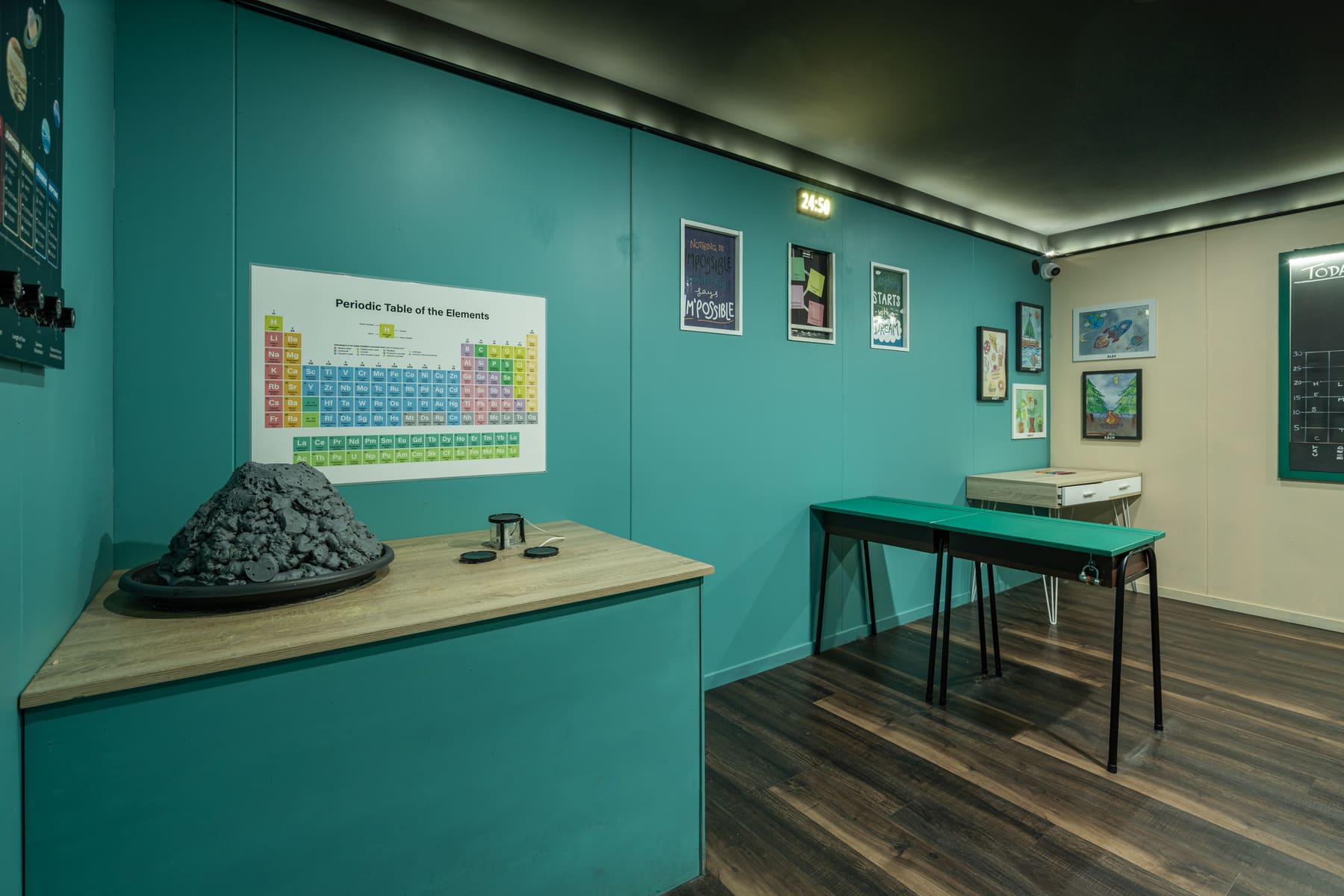 A colourful science classroom with desks and student artwork inside Riddle Ridge School.
